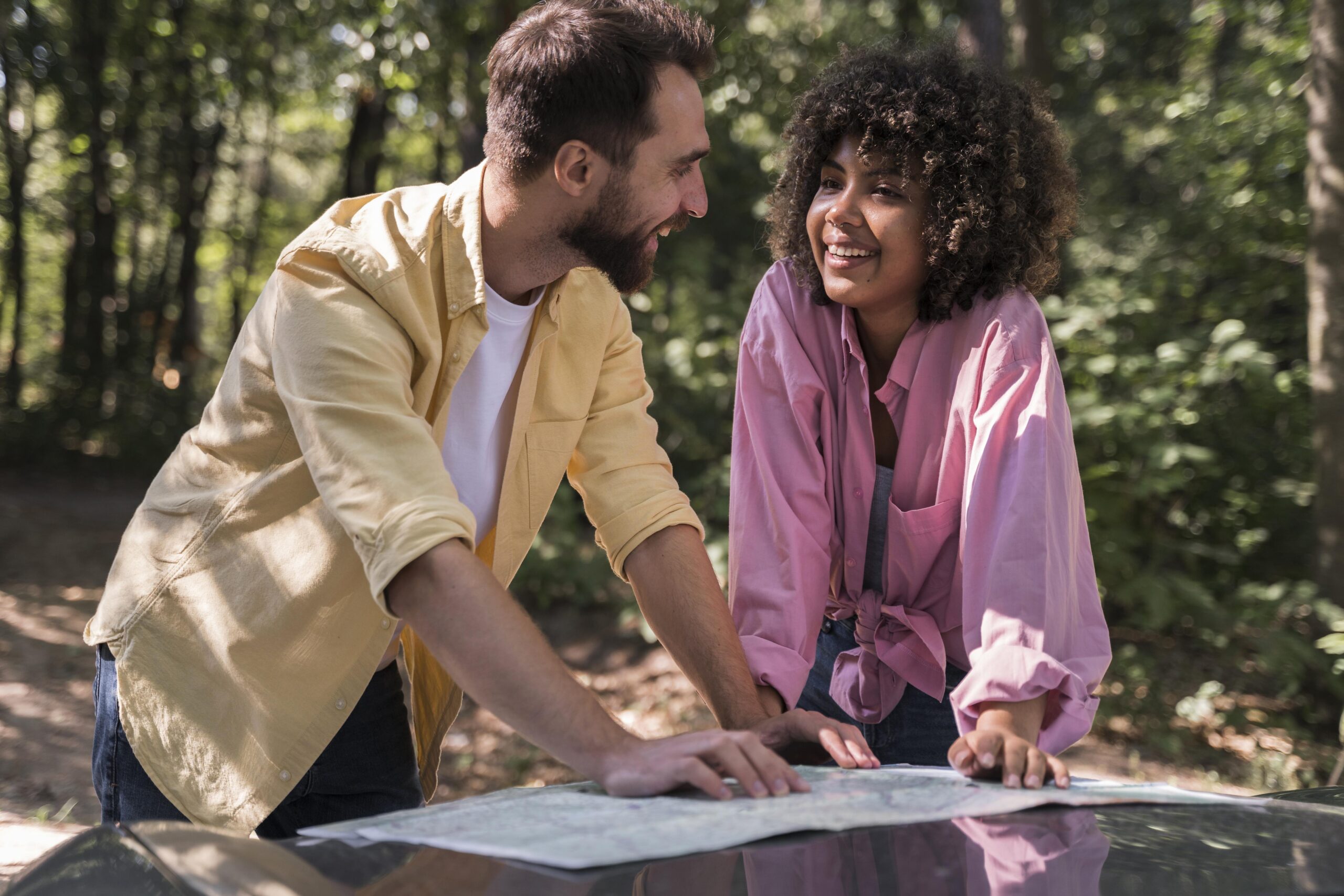 couple outdoors consulting map
