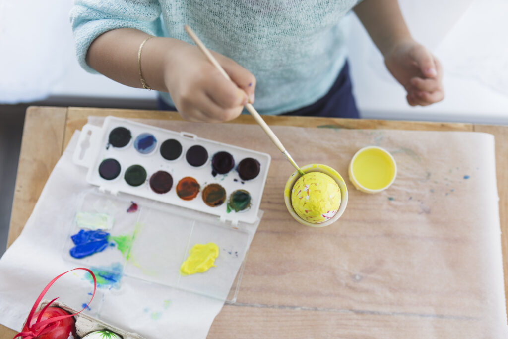 About Crop Child Painting Egg With Yellow 1024x683